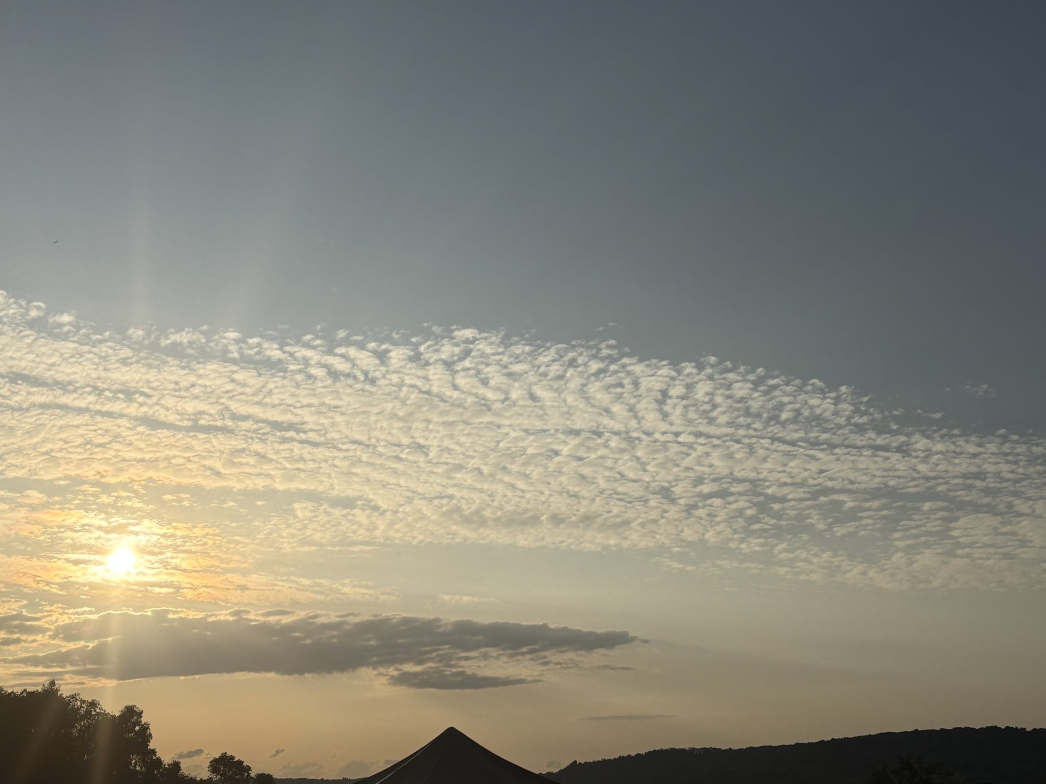 Sunset sky over fields that are potentially low carbon farming
